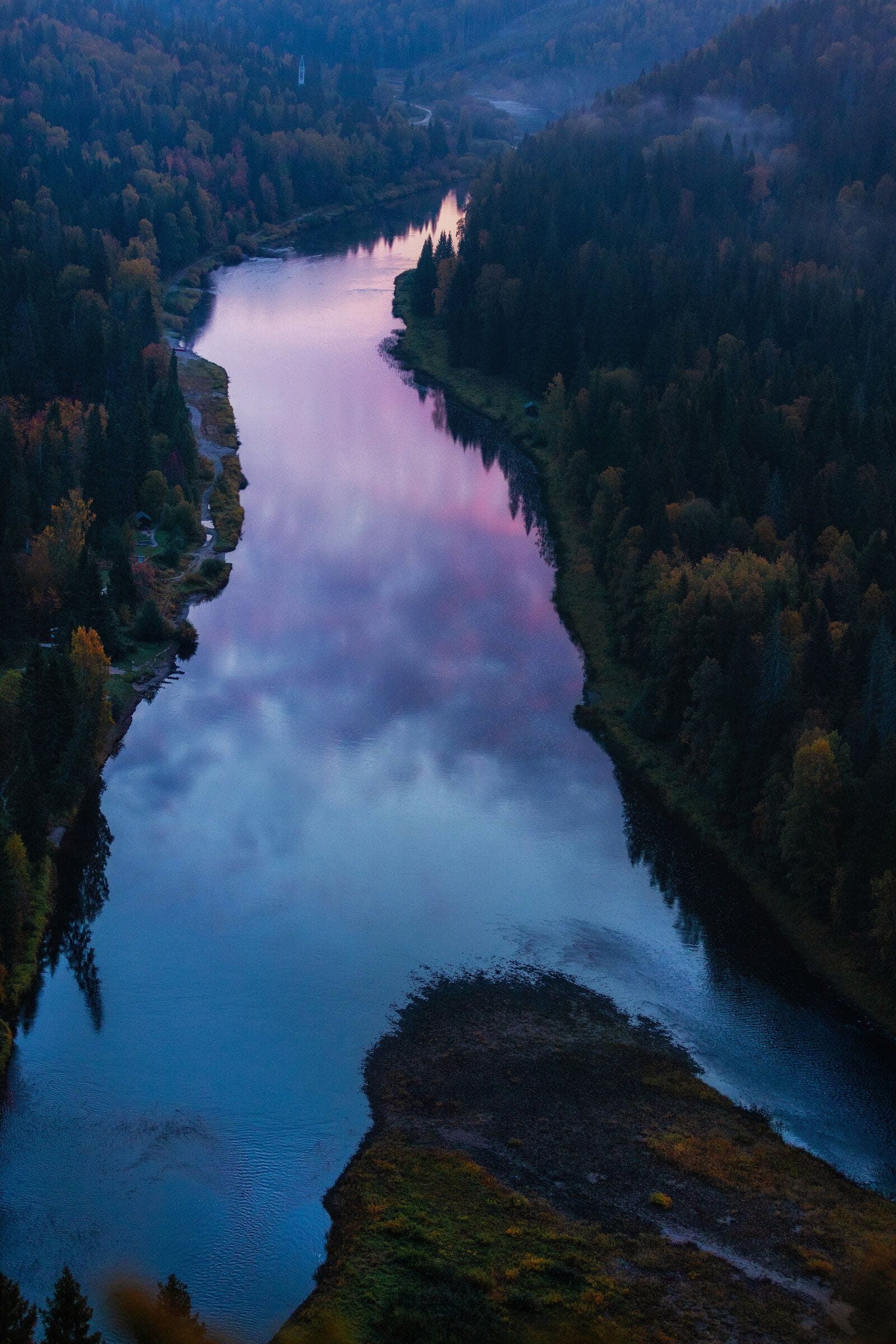 sunset-reflects-on-the-river-surrounded-by-trees